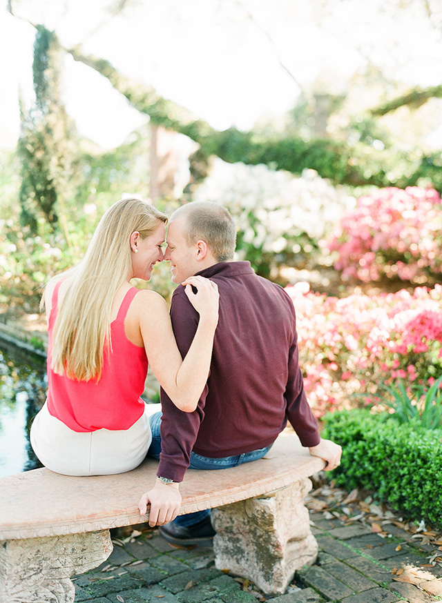 orlando, Jacksonville, engaged, engagement, photo session, garden, cummer garden, film, image, pink flowers, moss, hanging trees, oaks, stone bench, bright pink blouse