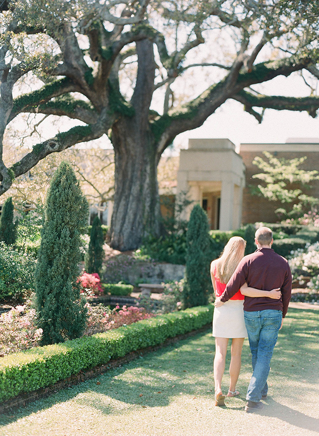 building, walk, stroll, holding hands, arm in arm, park, grass, sidewalk