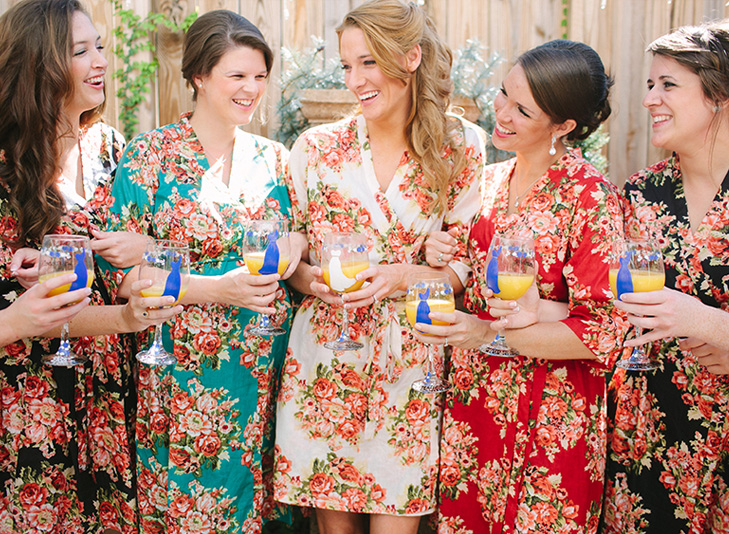 getting ready, bridesmaids with matching robes, painted wine glass, laughing with bridesmaids