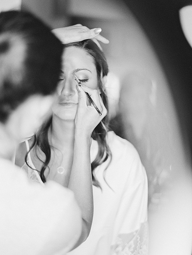 black and white image of bride getting ready for her wedding day