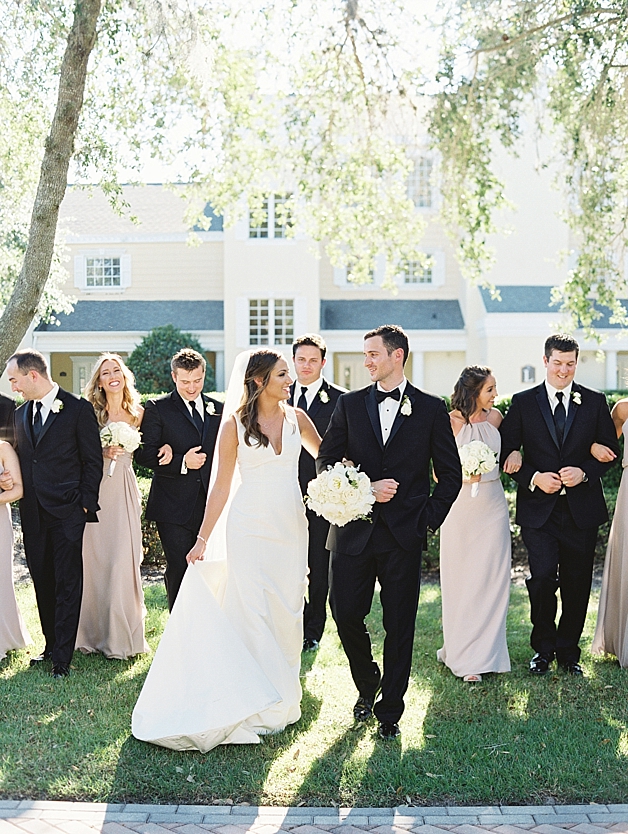 Bride and groom with sophisticated bridal party 