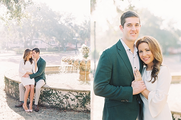 engagement couple sitting by a fountain in foggy sunlight