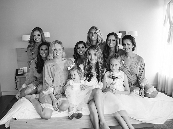 bridesmaids all on a bed in robes before getting into bridesmaids dresses | NYC Wedding Photographer | Beacon Roundhouse New York Wedding | photographed by Kt Crabb Photography