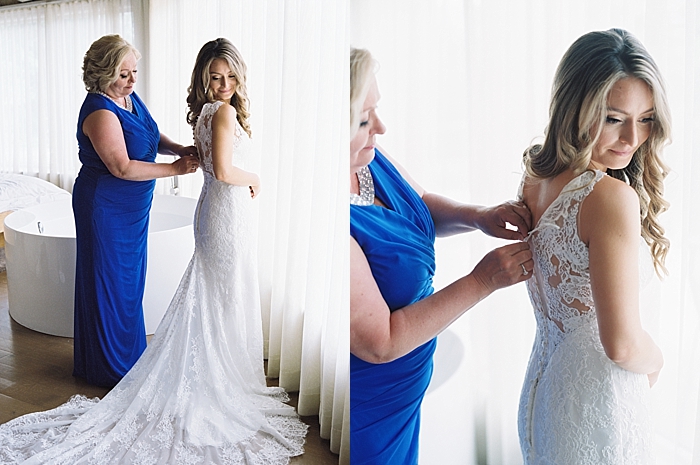mother helping bride get into wedding dress | NYC Wedding Photographer | Beacon Roundhouse New York Wedding | photographed by Kt Crabb Photography