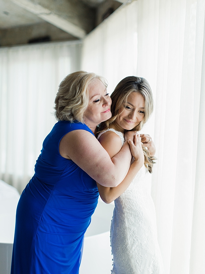 bride and mother of bride hug before wedding ceremony | NYC Wedding Photographer | Beacon Roundhouse New York Wedding | photographed by Kt Crabb Photography