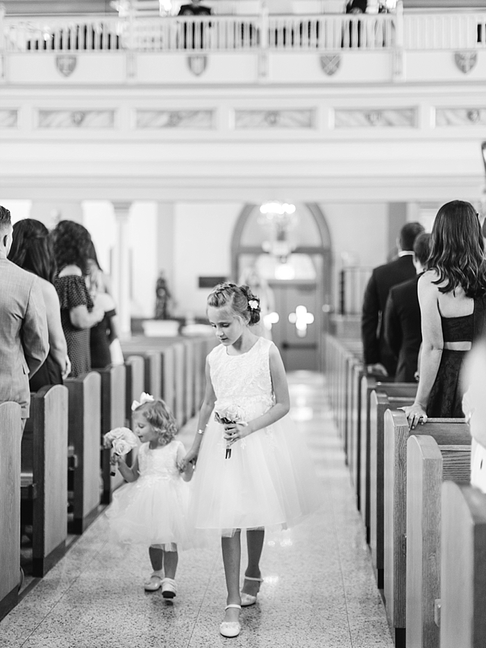 black and white photo of flower girls walking down aisle | NYC Wedding Photographer | Beacon Roundhouse New York Wedding | photographed by Kt Crabb Photography