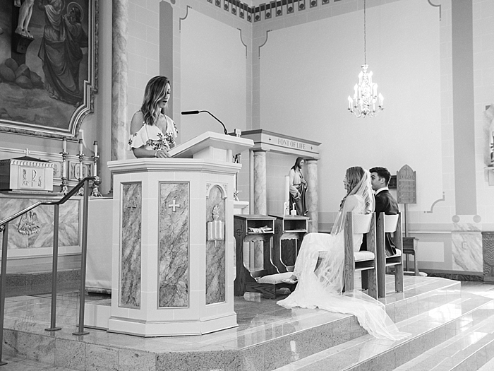 woman reading scripture to bride and groom during wedding ceremony | NYC Wedding Photographer | Beacon Roundhouse New York Wedding | photographed by Kt Crabb Photography