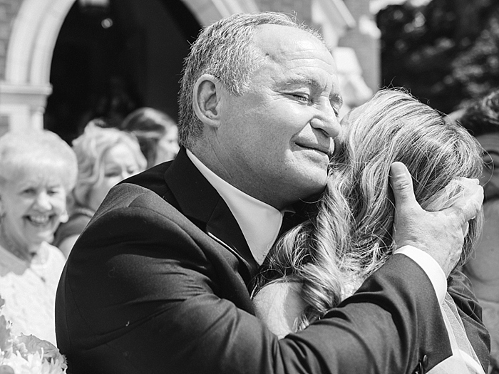 father of the bride hugs his daughter, the bride, after the wedding ceremony | NYC Wedding Photographer | Beacon Roundhouse New York Wedding | photographed by Kt Crabb Photography