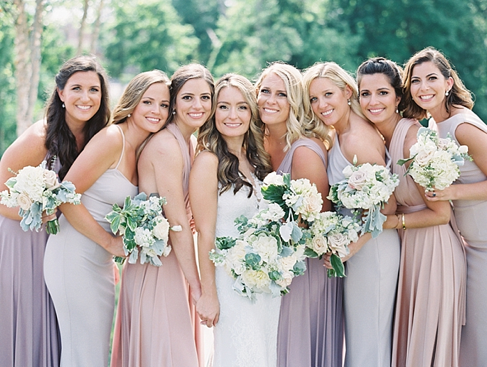 bridesmaids wearing a variety of gown styles and colors, purples pinks, and lavender | NYC Wedding Photographer | Beacon Roundhouse New York Wedding | photographed by Kt Crabb Photography