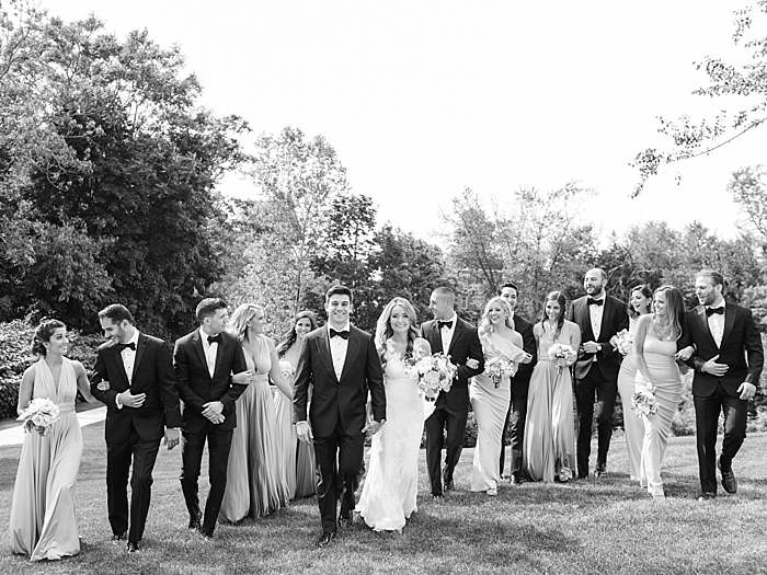 black and white photo of wedding party or bridal party walking towards camera | NYC Wedding Photographer | Beacon Roundhouse New York Wedding | photographed by Kt Crabb Photography