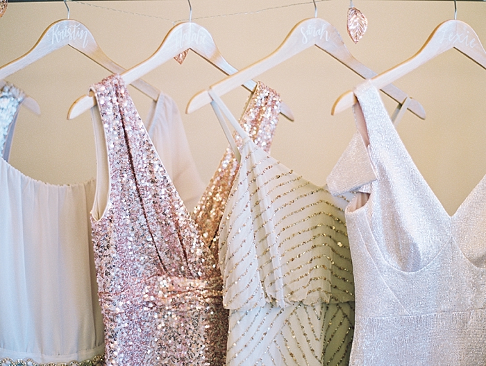 bridesmaids dresses hanging in a row together