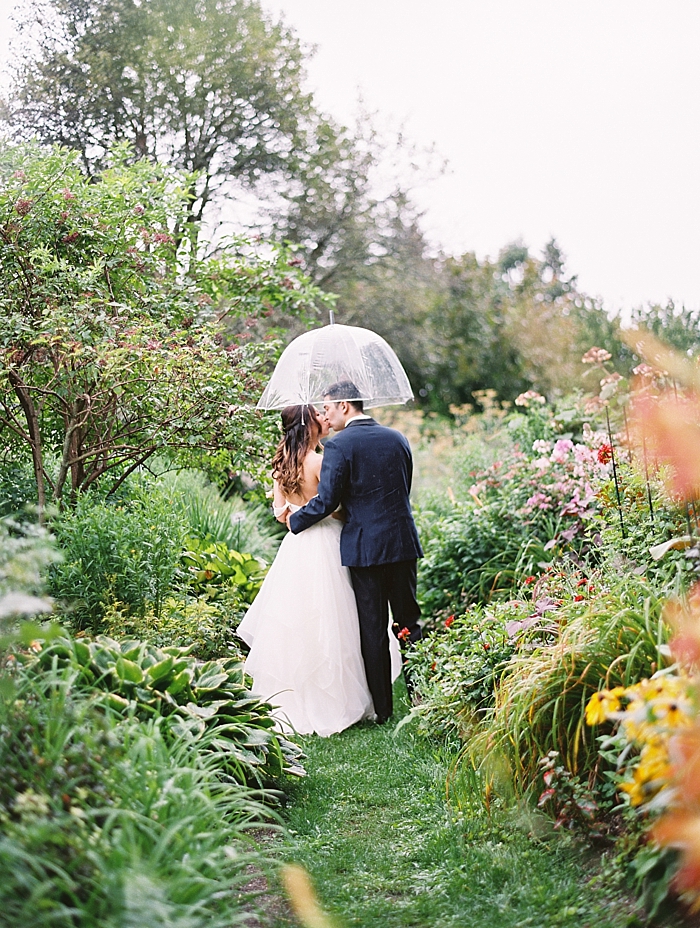 garden wedding rainy umbrella