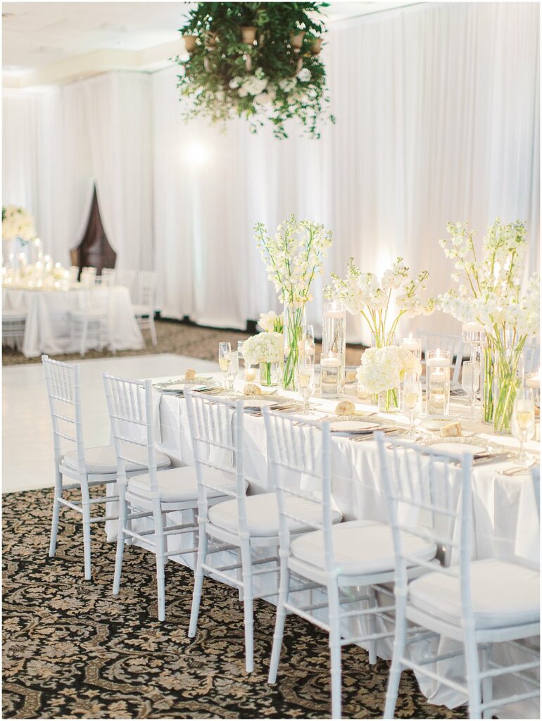 reception hall with white chairs and white dance floor at Bella Collina Orlando Wedding