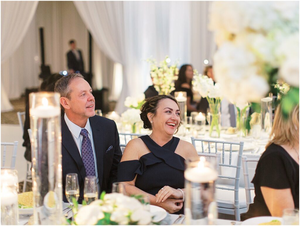 wedding guests laugh during toasts at Bella Collina Orlando Wedding