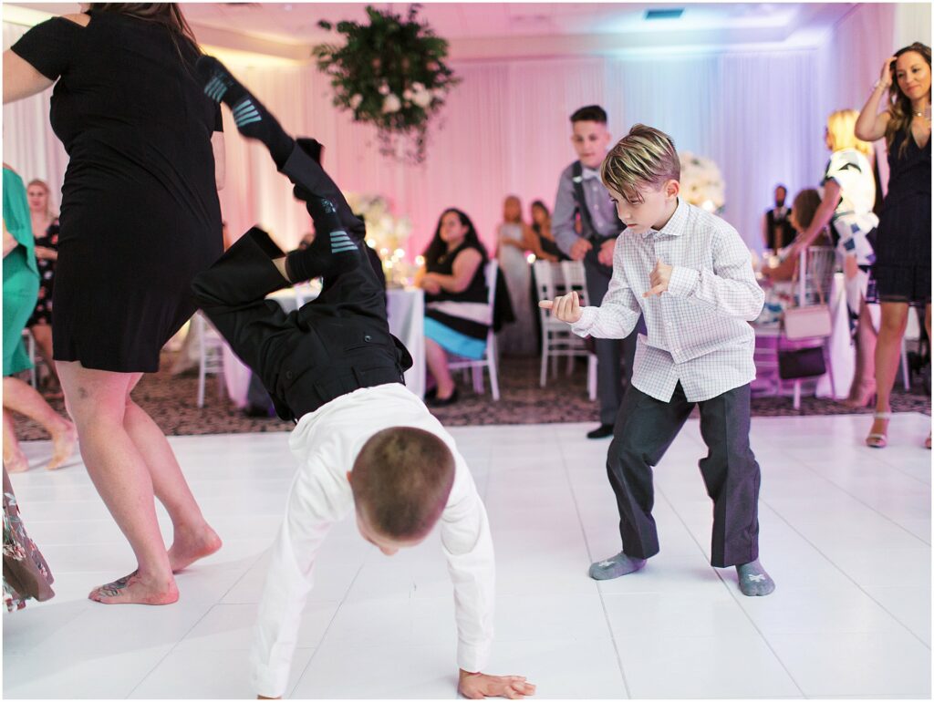 ring bearer and young boy dancing at Bella Collina Orlando Wedding