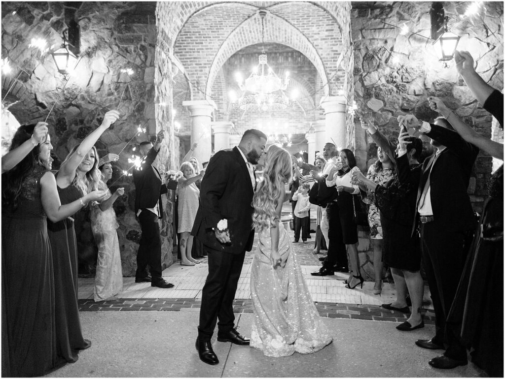 bride and groom kiss during sparkler send off at Bella Collina Orlando Wedding